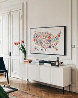 Wild Meadow USA by Laura Marshall. shown as a framed stretched canvas in a living room above a console. Available as a archival giclee rolled canvas, fine art paper, or poster print. SKU 80477i.