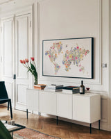 Wild Meadow World by Laura Marshall. shown as a framed stretched canvas in a living room above a console. Available as a archival giclee rolled canvas, fine art paper, or poster print. SKU 79367i.
