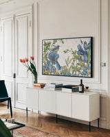 Blue Botanica I by Leslie Trimbach. shown as a framed stretched canvas in a living room above a console. Available as a archival giclee rolled canvas, fine art paper, or poster print. SKU 100414i.