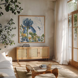 Blue Botanica IV by Leslie Trimbach. Shown in a natural wood frame in a cozy modern living room. Available as an archival giclee rolled canvas, fine art paper, or poster print. SKU 100417a.