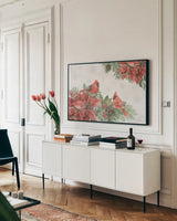 Feathered Festivities I by Leslie Trimbach. shown as a framed stretched canvas in a living room above a console. Available as a archival giclee rolled canvas, fine art paper, or poster print. SKU 89074i.