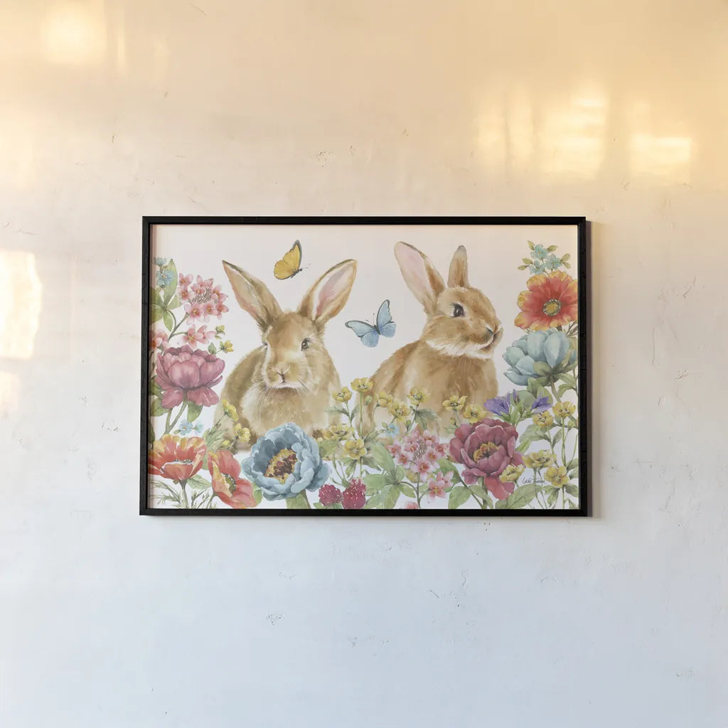 Garden Bunnies I by Leslie Trimbach. shown as a paper print in a black flame. Available as a archival giclee rolled canvas, fine art paper, or poster print. SKU 83601i.