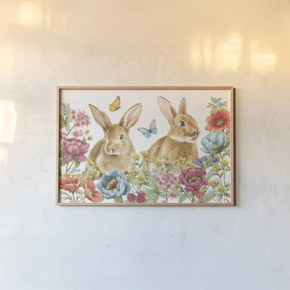 Garden Bunnies I by Leslie Trimbach. shown as a paper print in a natural frame. Available as a archival giclee rolled canvas, fine art paper, or poster print. SKU 83601i.