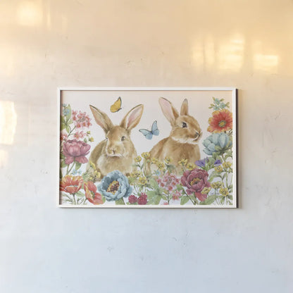 Garden Bunnies I by Leslie Trimbach. shown as a paper print in a white frame. Available as a archival giclee rolled canvas, fine art paper, or poster print. SKU 83601i.