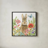 Garden Bunnies III by Leslie Trimbach. Shown in a sleek black glass frame for a contemporary gallery look. Available as an archival giclee rolled canvas, fine art paper, or poster print. SKU 83603a.