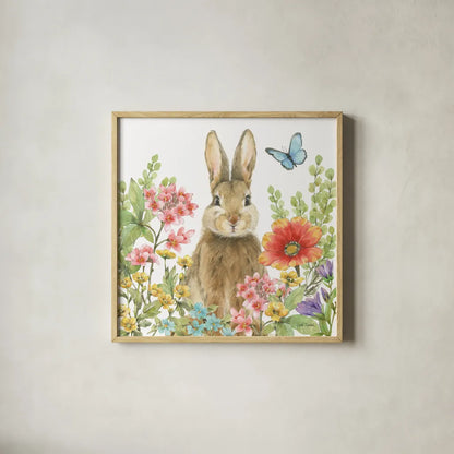 Garden Bunnies III by Leslie Trimbach. Shown in a natural wood glass frame for a timeless modern aesthetic. Available as an archival giclee rolled canvas, fine art paper, or poster print. SKU 83603a.