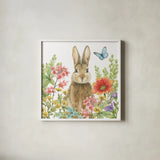 Garden Bunnies III by Leslie Trimbach. Shown in a crisp white glass frame for a clean and minimalist style. Available as an archival giclee rolled canvas, fine art paper, or poster print. SKU 83603a.