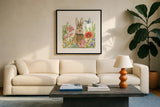 Garden Bunnies III by Leslie Trimbach. Displayed in a glass frame with matte in a clean modern living room. Available as an archival giclee rolled canvas, fine art paper, or poster print. SKU 83603a.