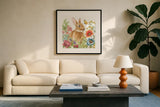 Garden Bunnies V by Leslie Trimbach. Displayed in a glass frame with matte in a clean modern living room. Available as an archival giclee rolled canvas, fine art paper, or poster print. SKU 83605a.