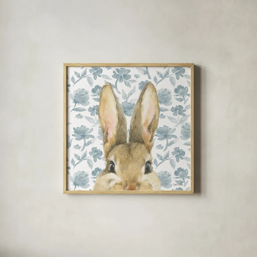 Garden Bunnies VI by Leslie Trimbach. Shown in a natural wood glass frame for a timeless modern aesthetic. Available as an archival giclee rolled canvas, fine art paper, or poster print. SKU 83606a.