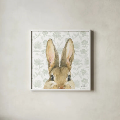 Garden Bunnies VI Sage by Leslie Trimbach. Shown in a crisp white glass frame for a clean and minimalist style. Available as an archival giclee rolled canvas, fine art paper, or poster print. SKU 84098a.