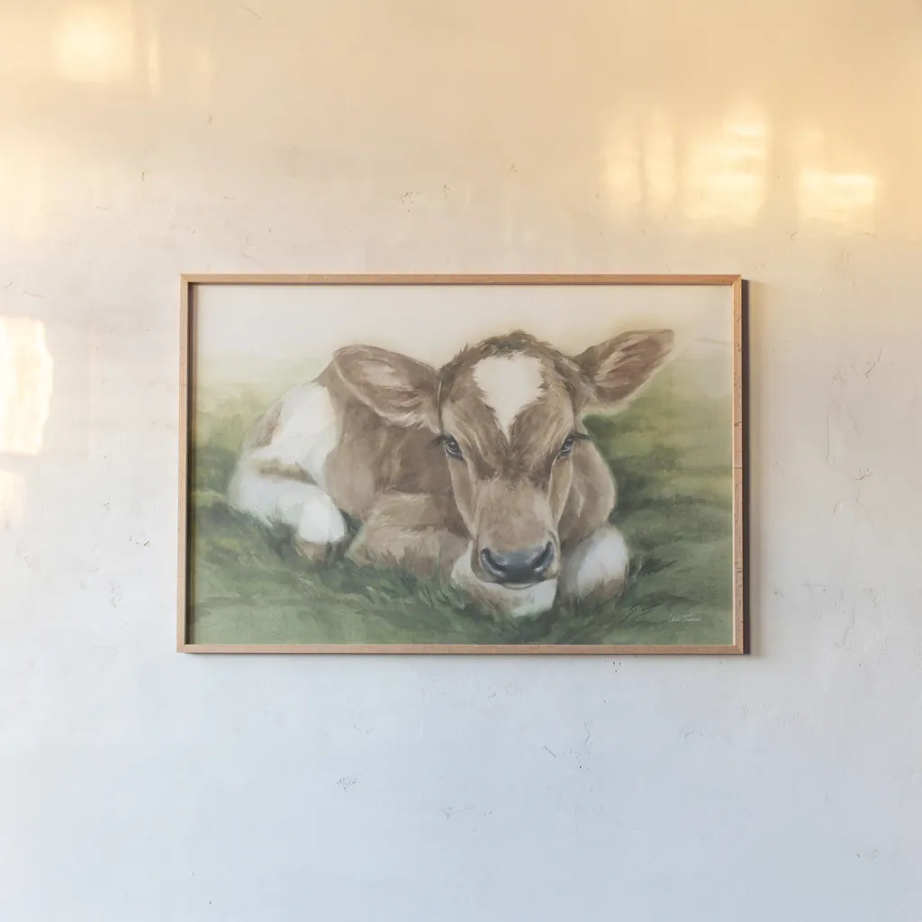 Gentle Calf by Leslie Trimbach. shown as a paper print in a natural frame. Available as a archival giclee rolled canvas, fine art paper, or poster print. SKU 87356i.
