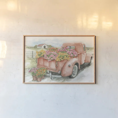 Red Truck with Flowers by Leslie Trimbach. shown as a paper print in a natural frame. Available as a archival giclee rolled canvas, fine art paper, or poster print. SKU 96646i.