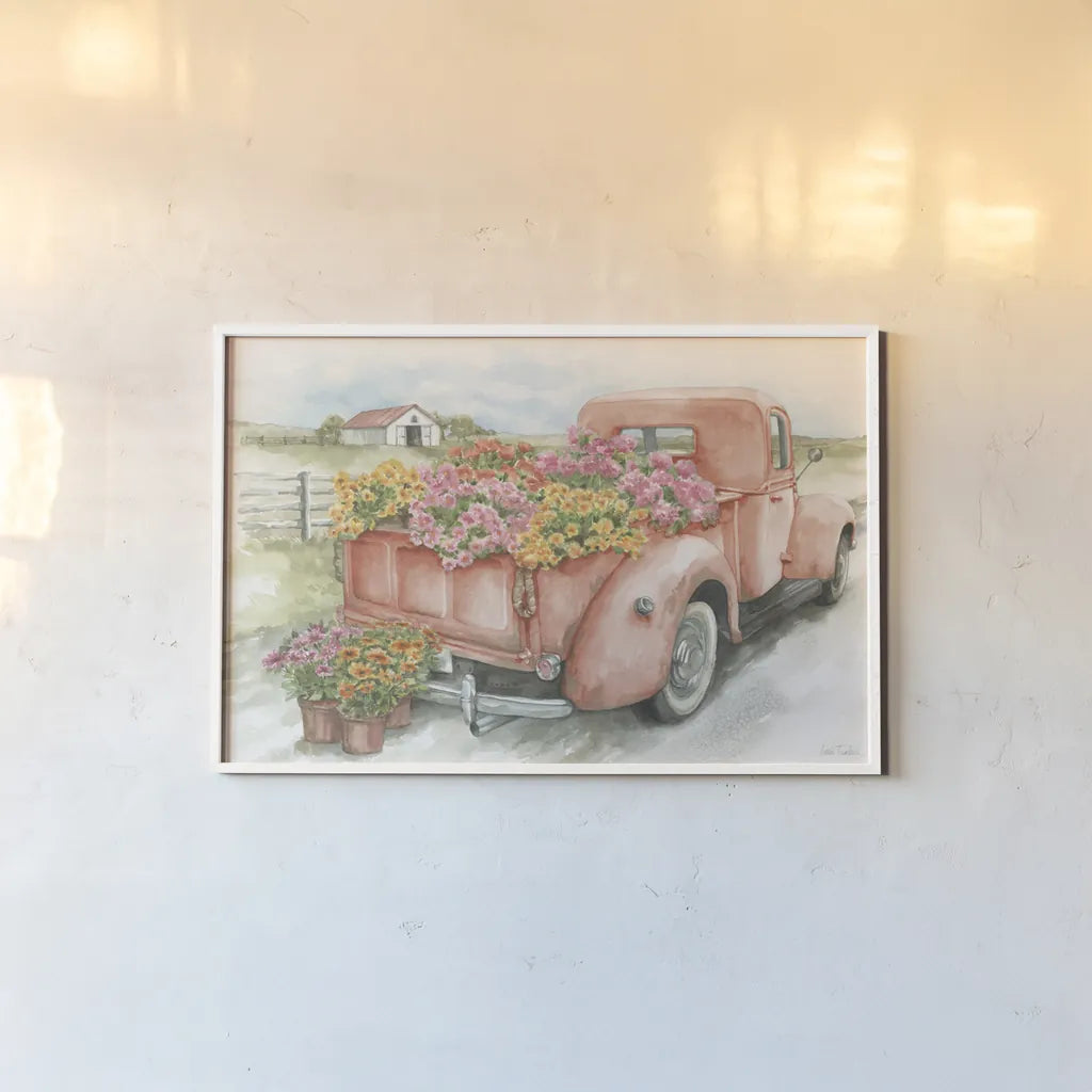 Red Truck with Flowers by Leslie Trimbach. shown as a paper print in a white frame. Available as a archival giclee rolled canvas, fine art paper, or poster print. SKU 96646i.