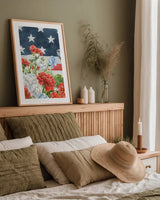 Red White and Blue Floral VI by Leslie Trimbach. shown as a paper print in a natural frame. Available as a archival giclee rolled canvas, fine art paper, or poster print. SKU 98889h.