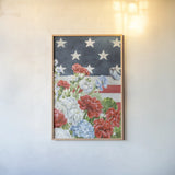 Red White and Blue Floral VI by Leslie Trimbach. shown as a paper print in a natural frame. Available as a archival giclee rolled canvas, fine art paper, or poster print. SKU 98889h.