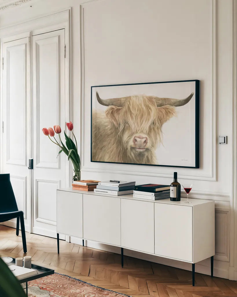 Shetland Cow by Leslie Trimbach. shown as a framed stretched canvas in a living room above a console. Available as a archival giclee rolled canvas, fine art paper, or poster print. SKU 84629i.