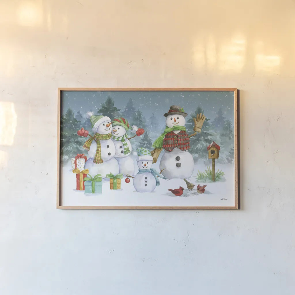 Snowman Family I by Leslie Trimbach. shown as a paper print in a natural frame. Available as a archival giclee rolled canvas, fine art paper, or poster print. SKU 85253i.