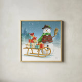 Snowman Family IV by Leslie Trimbach. Shown in a natural wood glass frame for a timeless modern aesthetic. Available as an archival giclee rolled canvas, fine art paper, or poster print. SKU 85256a.