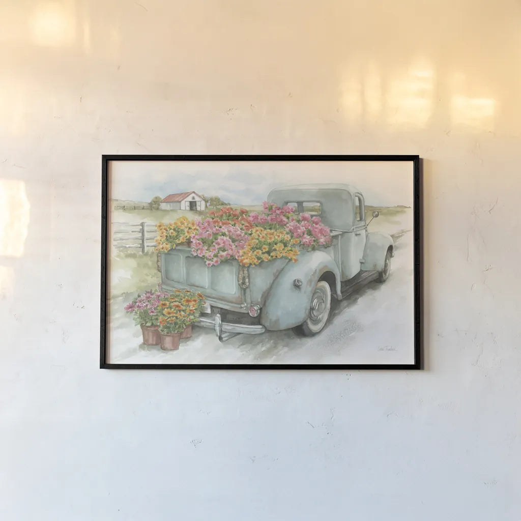 Truck with Flowers by Leslie Trimbach. shown as a paper print in a black flame. Available as a archival giclee rolled canvas, fine art paper, or poster print. SKU 84630i.