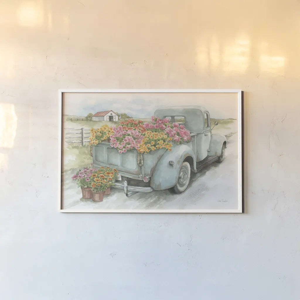 Truck with Flowers by Leslie Trimbach. shown as a paper print in a white frame. Available as a archival giclee rolled canvas, fine art paper, or poster print. SKU 84630i.