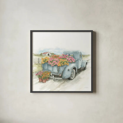 Truck with Flowers on Blue Sq by Leslie Trimbach. Shown in a sleek black glass frame for a contemporary gallery look. Available as an archival giclee rolled canvas, fine art paper, or poster print. SKU 86877a.