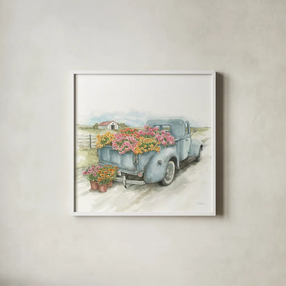 Truck with Flowers on Blue Sq by Leslie Trimbach. Shown in a crisp white glass frame for a clean and minimalist style. Available as an archival giclee rolled canvas, fine art paper, or poster print. SKU 86877a.
