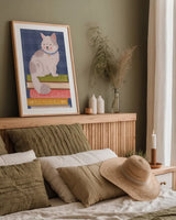 Cozy Readers Club IV by Lindley Wiesner. shown as a paper print in a natural frame. Available as a archival giclee rolled canvas, fine art paper, or poster print. SKU 97931h.
