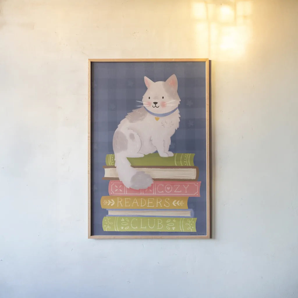 Cozy Readers Club IV by Lindley Wiesner. shown as a paper print in a natural frame. Available as a archival giclee rolled canvas, fine art paper, or poster print. SKU 97931h.