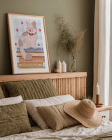 Cozy Readers Club IV v2 by Lindley Wiesner. shown as a paper print in a natural frame. Available as a archival giclee rolled canvas, fine art paper, or poster print. SKU 98237h.