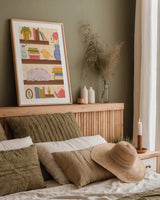 Cozy Readers Club V by Lindley Wiesner. shown as a paper print in a natural frame. Available as a archival giclee rolled canvas, fine art paper, or poster print. SKU 97932h.