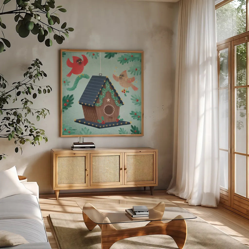 Holiday Birdhouse by Lindley Wiesner. Shown in a natural wood frame in a cozy modern living room. Available as an archival giclee rolled canvas, fine art paper, or poster print. SKU 93273a.