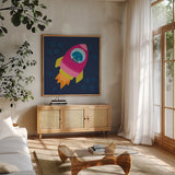 Space Tails VI by Lindley Wiesner. Shown in a natural wood frame in a cozy modern living room. Available as an archival giclee rolled canvas, fine art paper, or poster print. SKU 98270a.