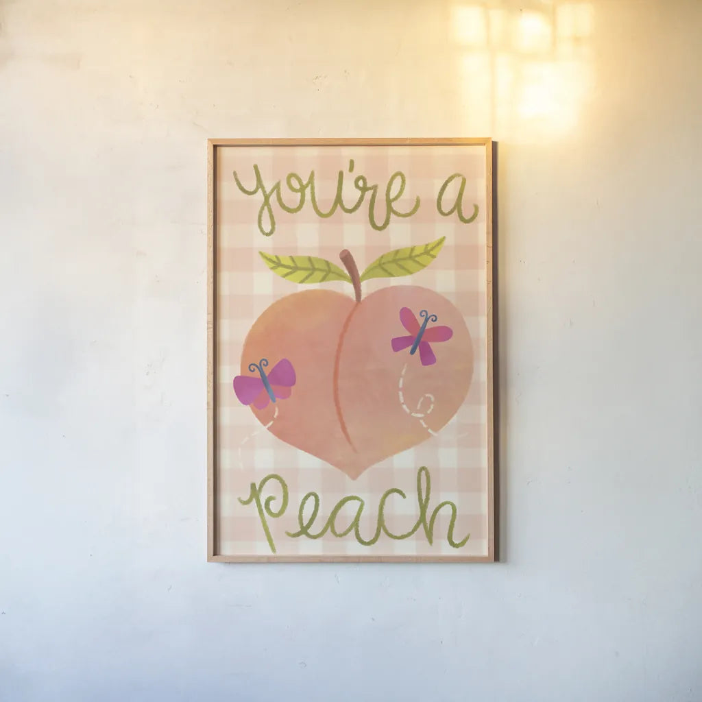 You're A Peach by Lindley Wiesner. shown as a paper print in a natural frame. Available as a archival giclee rolled canvas, fine art paper, or poster print. SKU 100039h.