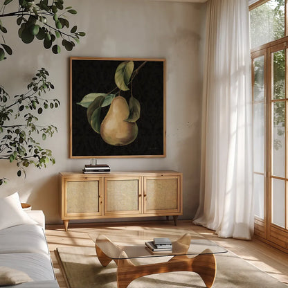 Fruit du Marche Pear on Black by Lisa Audit. Shown in a natural wood frame in a cozy modern living room. Available as an archival giclee rolled canvas, fine art paper, or poster print. SKU 90893a.