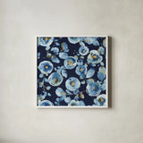 Indigold Flower Toss Indigo by Lisa Audit. Shown in a crisp white glass frame for a clean and minimalist style. Available as an archival giclee rolled canvas, fine art paper, or poster print. SKU 33664a.