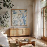 Mixed Greens LXVI Blue by Lisa Audit. Shown in a natural wood frame in a cozy modern living room. Available as an archival giclee rolled canvas, fine art paper, or poster print. SKU 42751a.