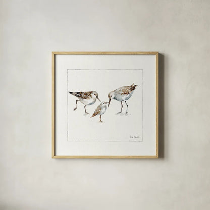 Pebbles And Sandpipers III v2 by Lisa Audit. Shown in a natural wood glass frame for a timeless modern aesthetic. Available as an archival giclee rolled canvas, fine art paper, or poster print. SKU 104091a.