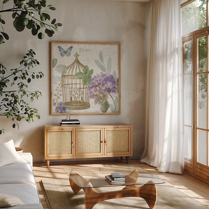 Rainbow Seeds Floral Birdcage II v2 by Lisa Audit. Shown in a natural wood frame in a cozy modern living room. Available as an archival giclee rolled canvas, fine art paper, or poster print. SKU 87449a.