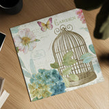 Rainbow Seeds Floral Birdcage III v2 by Lisa Audit. Shown as a detailed flat fine art print, highlighting archival giclee quality. Available as an archival giclee rolled canvas, fine art paper, or poster print. SKU 18823a.