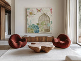 Rainbow Seeds Floral Birdcage III v2 by Lisa Audit. Shown as extra-large giant wall art in a modern living room. Available as an archival giclee rolled canvas, fine art paper, or poster print. SKU 18823a.