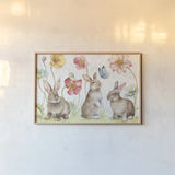 Spring Softies Bunnies I by Lisa Audit. shown as a paper print in a natural frame. Available as a archival giclee rolled canvas, fine art paper, or poster print. SKU 25952i.