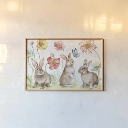 Spring Softies Bunnies I by Lisa Audit. shown as a paper print in a natural frame. Available as a archival giclee rolled canvas, fine art paper, or poster print. SKU 25952i.
