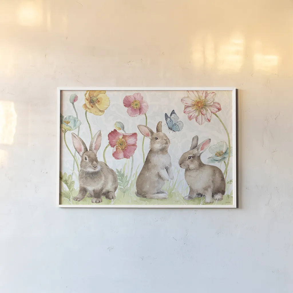 Spring Softies Bunnies I by Lisa Audit. shown as a paper print in a white frame. Available as a archival giclee rolled canvas, fine art paper, or poster print. SKU 25952i.