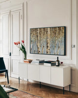White Forest by Lisa Audit. shown as a framed stretched canvas in a living room above a console. Available as a archival giclee rolled canvas, fine art paper, or poster print. SKU 1035i.