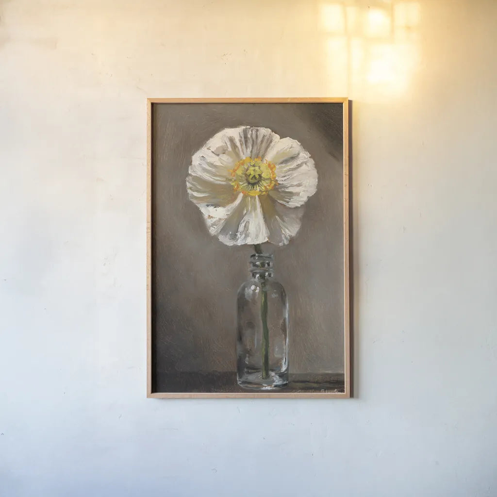 White Poppy by Mackenzie Nelson. shown as a paper print in a natural frame. Available as a archival giclee rolled canvas, fine art paper, or poster print. SKU 102204h.