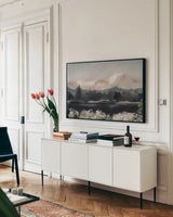 Dusklight Blossoms by Maggie Sackmann. shown as a framed stretched canvas in a living room above a console. Available as a archival giclee rolled canvas, fine art paper, or poster print. SKU 103128i.