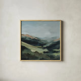 In the Valleys Embrace by Maggie Sackmann. Shown in a natural wood glass frame for a timeless modern aesthetic. Available as an archival giclee rolled canvas, fine art paper, or poster print. SKU 101897a.