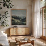 In the Valleys Embrace by Maggie Sackmann. Shown in a natural wood frame in a cozy modern living room. Available as an archival giclee rolled canvas, fine art paper, or poster print. SKU 101897a.