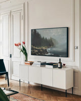Obsidian Tide v2 by Maggie Sackmann. shown as a framed stretched canvas in a living room above a console. Available as a archival giclee rolled canvas, fine art paper, or poster print. SKU 103484i.